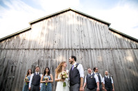 rustic barn with bride and groom and their bridal party