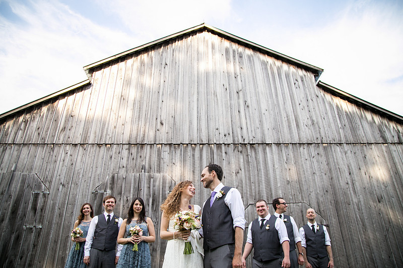 rustic barn with bride and groom and their bridal party
