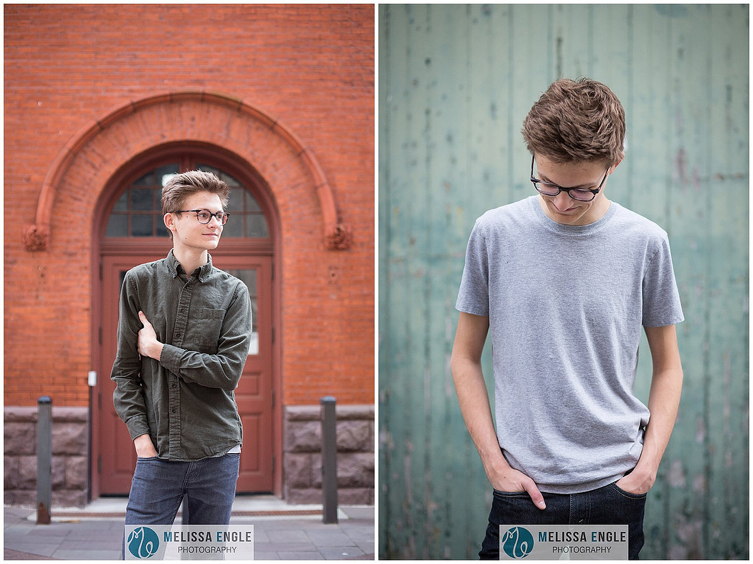 Senior portrait of a guy wearing glasses in downtown Lancaster City.