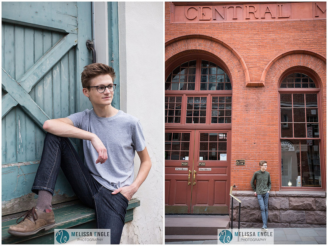 Creative senior portrait of a guy wearing glasses in an urban setting in downtown Lancaster City.