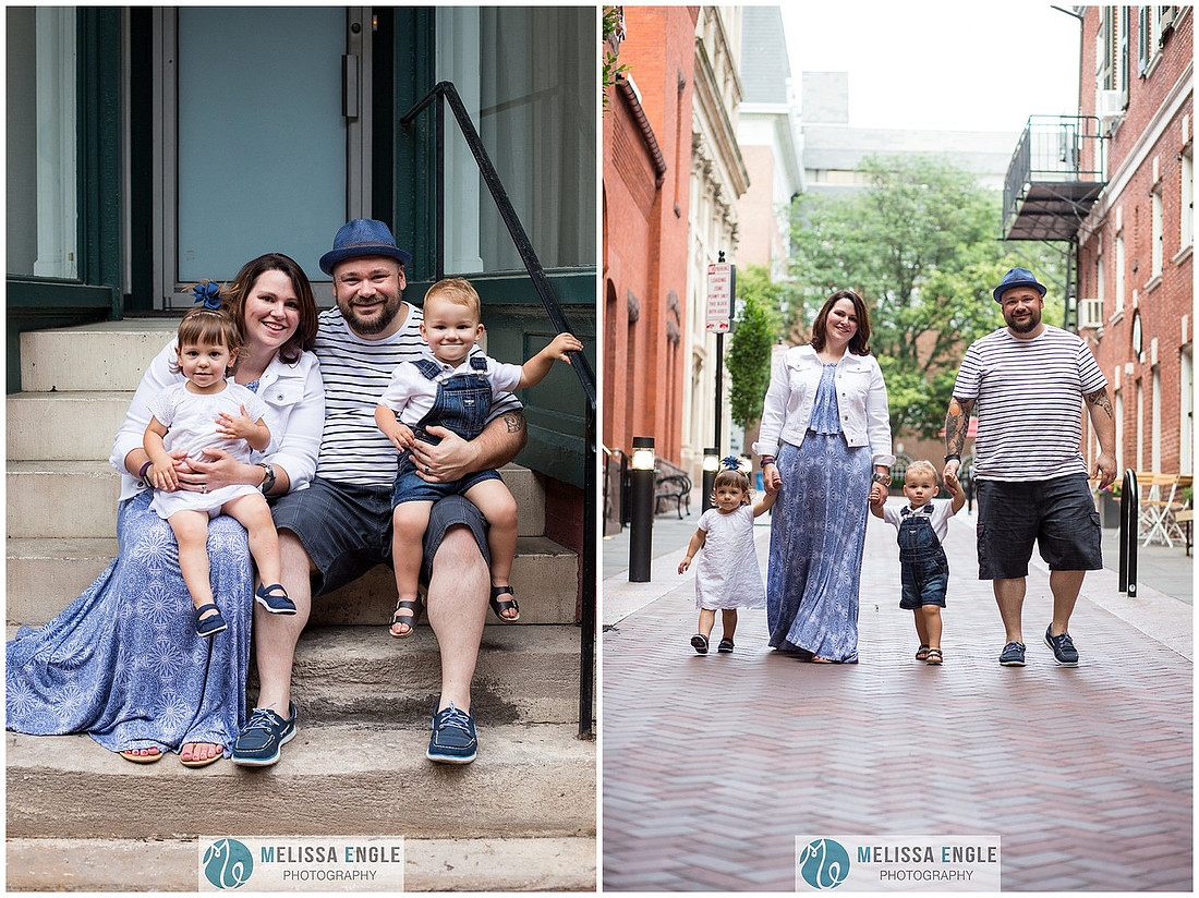 Candid family photo of parents with twins in downtown Lancaster City, PA.