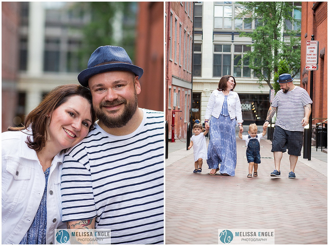 Candid family photo of parents with twins in downtown Lancaster City, PA.