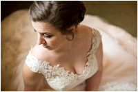 photo of a bride taken from above with windowlight and her wedding gown spread around her at Ironstone Ranch in Elizabethtown, PA