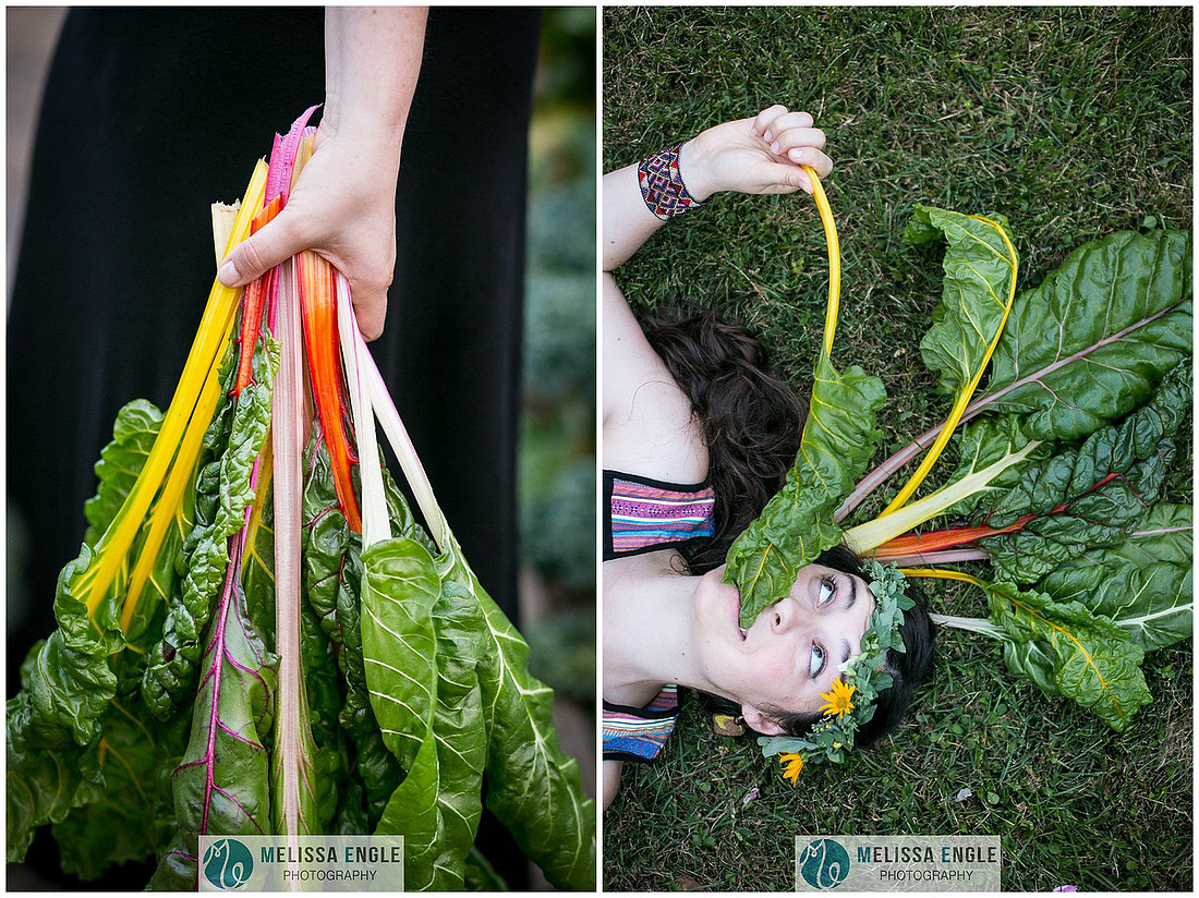 Photo of a young woman lying in the grass surrounded by rainbow swiss chard.