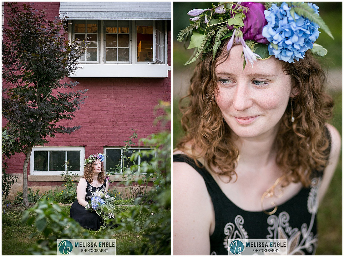 Beautiful photo of a young red haired woman wearing a flower crown of ferns, hydrangea and purple cabbage sitting in a backyard in Lancaster City, Cabbage Hill neighborhood.