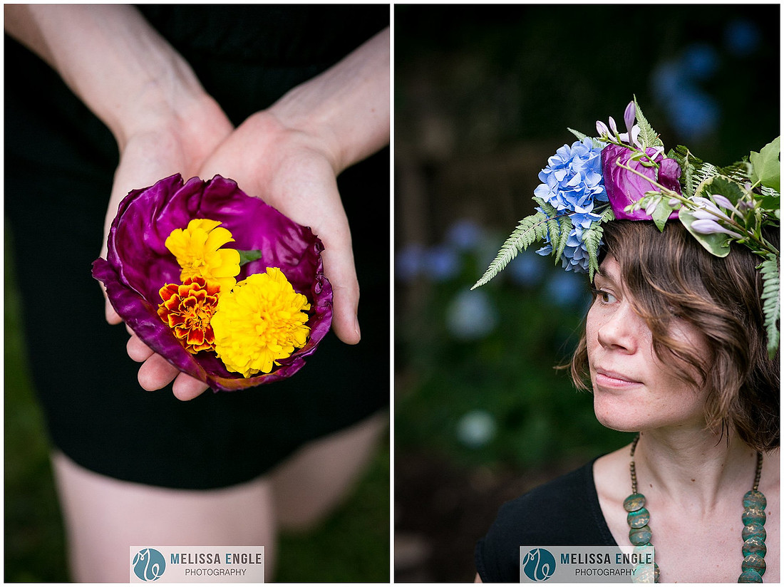 Close up portrait photo of a woman wearing a flower crown and holding a leaf of purple cabbage with yellow marigold flowers inside.