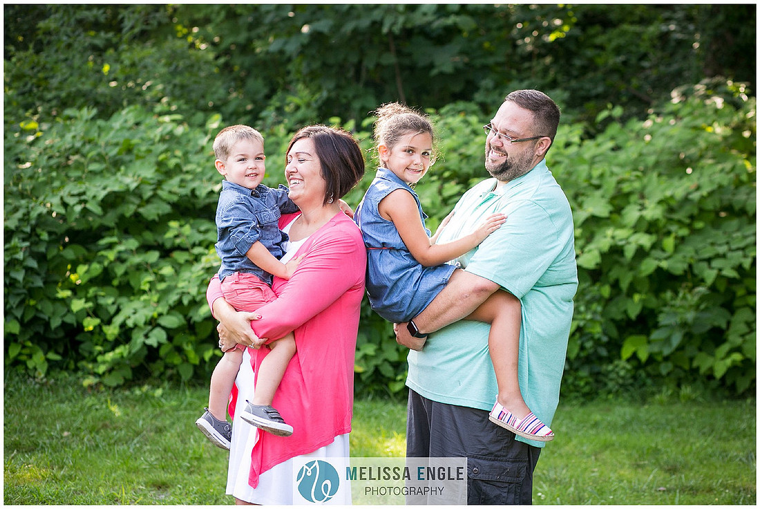 Photo of a family of four laughing and smiling on City Island in Harrisburg, PA