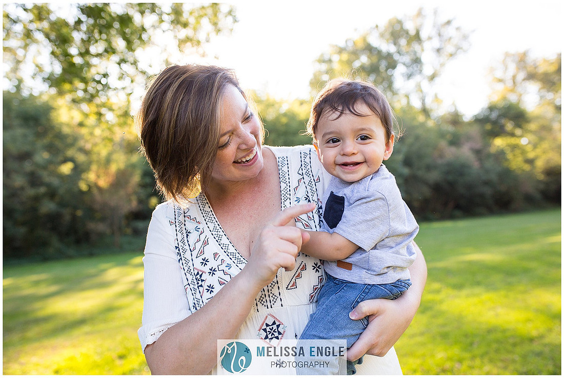 Beautiful, happy, candid backlit mother and son photo by lifestyle photographer Melissa Engle Photography.
