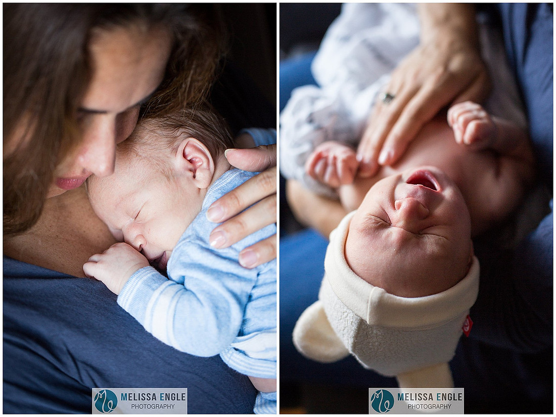 Photo of a young mother holding her newborn infant while he sleeps.